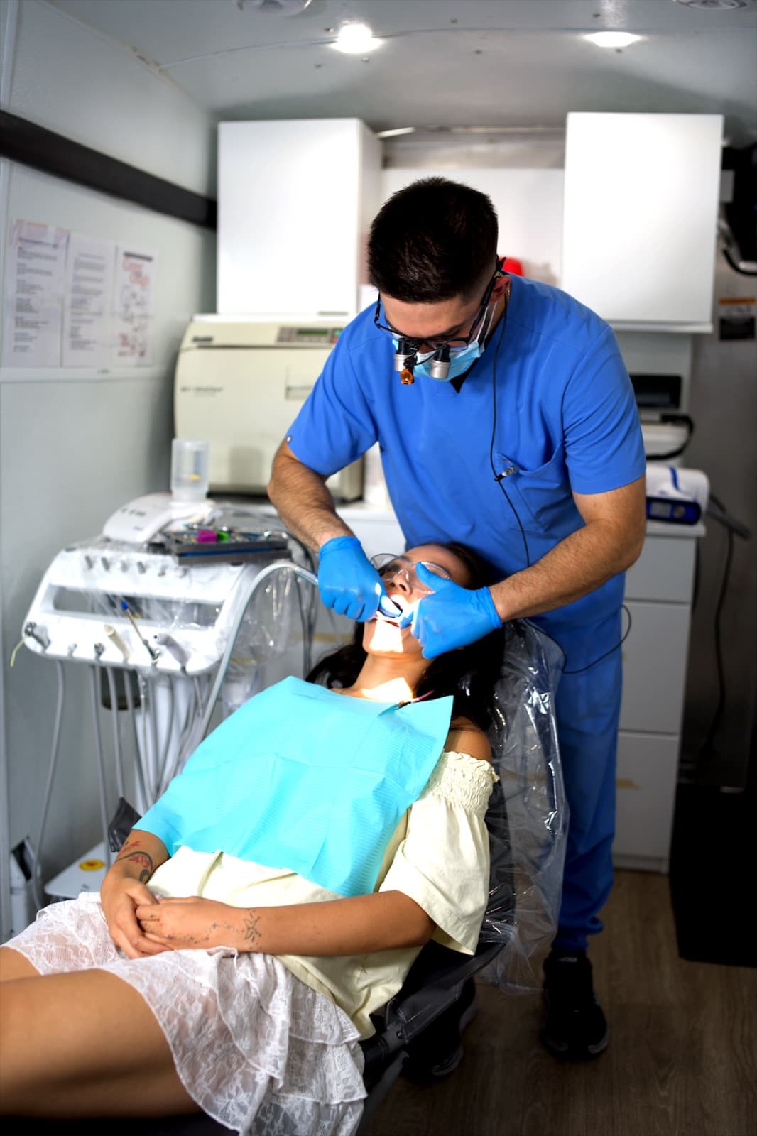 Dr. Milad Gheisari treating a patient inside the Las Vegas Mobile Dental Clinic van