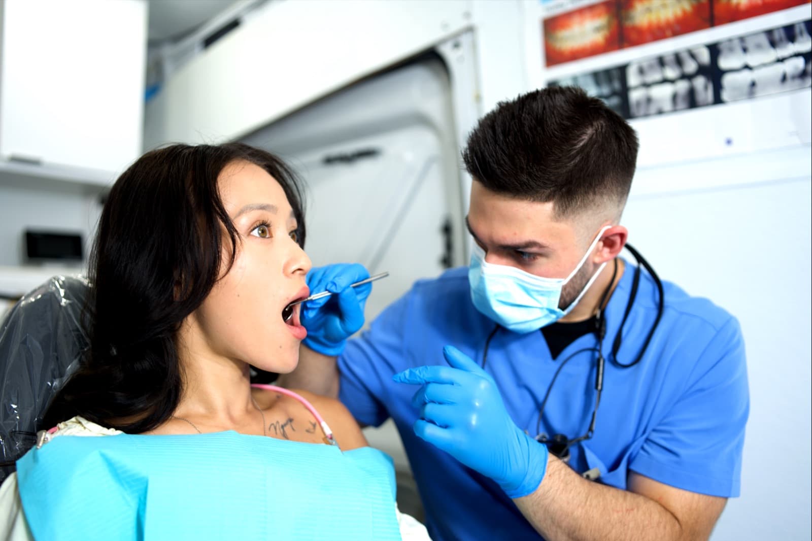 A dentist carefully examining a patient during an on-site mobile dental visit in Las Vegas